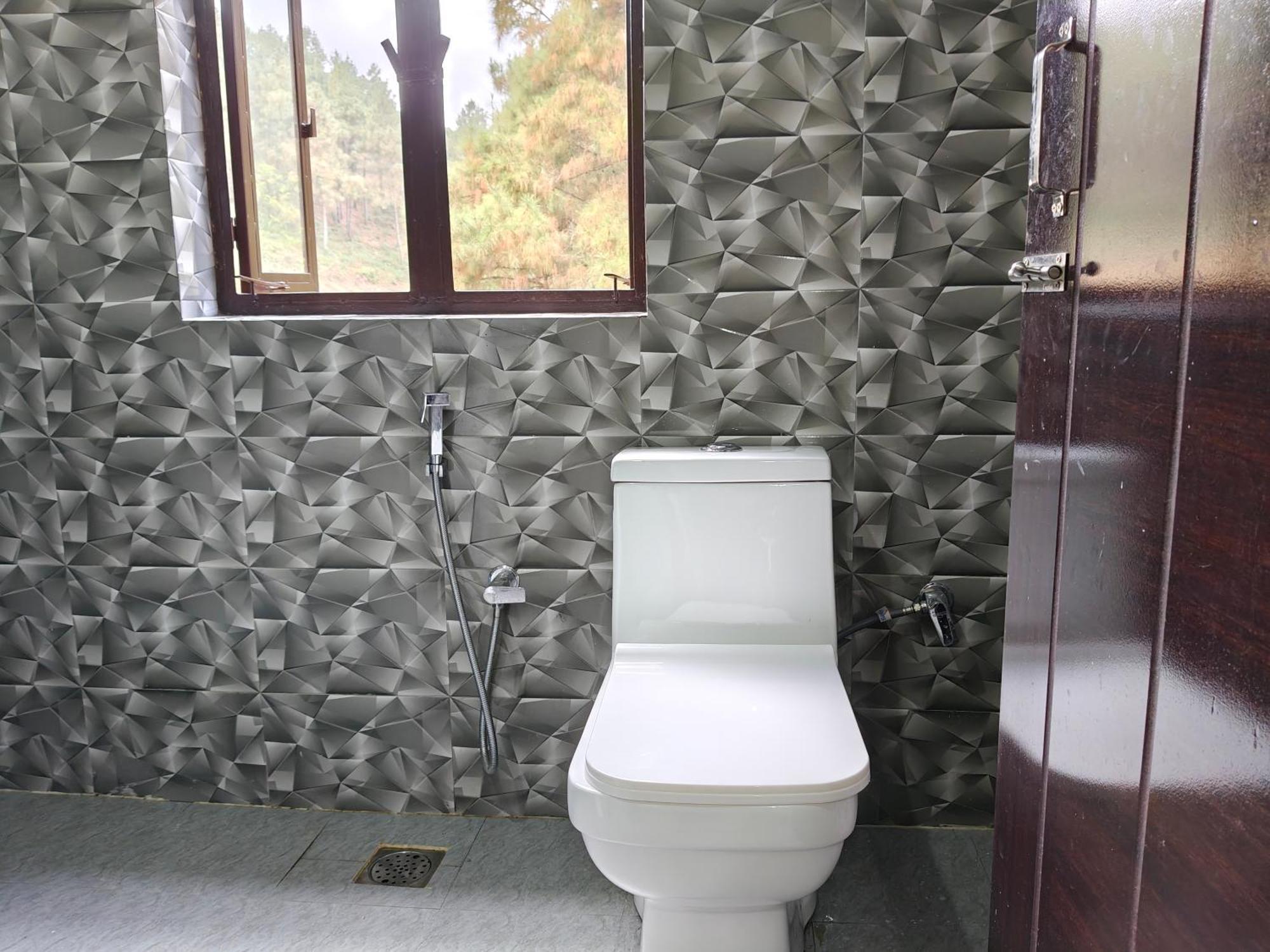 Xtsy Travellers Hostel Σιλόνγκ Δωμάτιο φωτογραφία